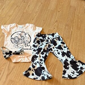 Peach Graphic Baby Onesie with Black & White Cow Print Bell Bottoms Set